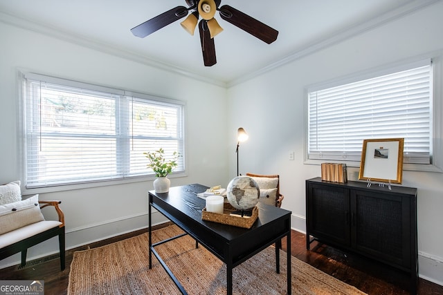 home office featuring dark wood-type flooring, ceiling fan, and ornamental molding