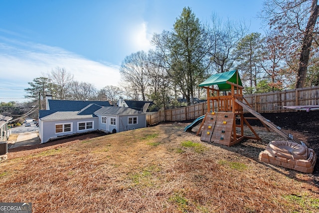 view of jungle gym featuring cooling unit and a yard