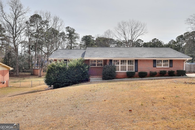 ranch-style house featuring a front lawn