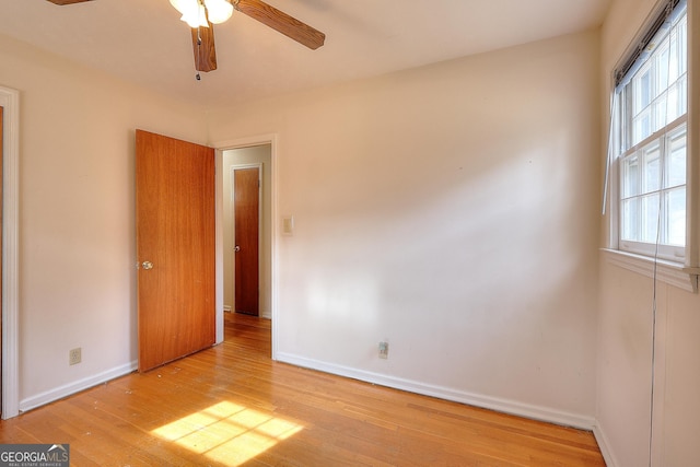 unfurnished bedroom featuring light hardwood / wood-style floors and ceiling fan