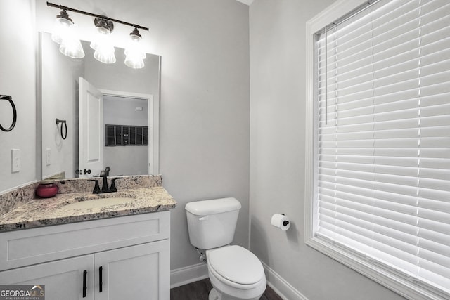 bathroom with vanity and toilet