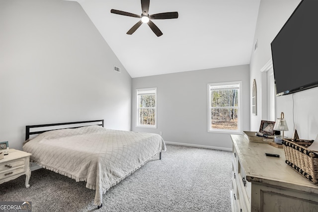 carpeted bedroom featuring multiple windows, high vaulted ceiling, and ceiling fan