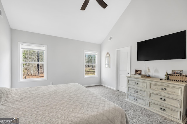 bedroom featuring light carpet, high vaulted ceiling, and ceiling fan