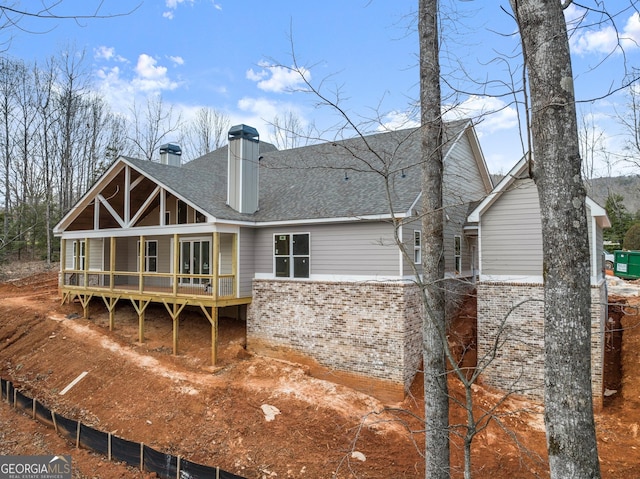 back of house featuring covered porch