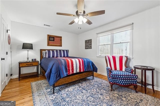 bedroom featuring hardwood / wood-style flooring and ceiling fan