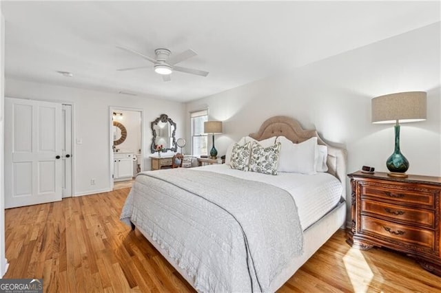 bedroom featuring ceiling fan, connected bathroom, and light hardwood / wood-style floors