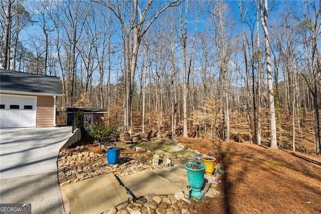 view of yard featuring a garage