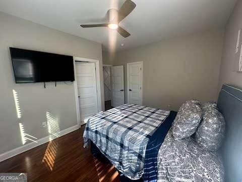 bedroom featuring dark hardwood / wood-style floors and ceiling fan