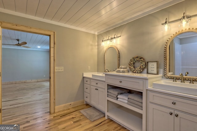 bathroom with wood-type flooring, vanity, crown molding, ceiling fan, and wood ceiling