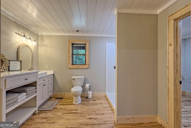 bathroom with hardwood / wood-style flooring, vanity, and wooden ceiling