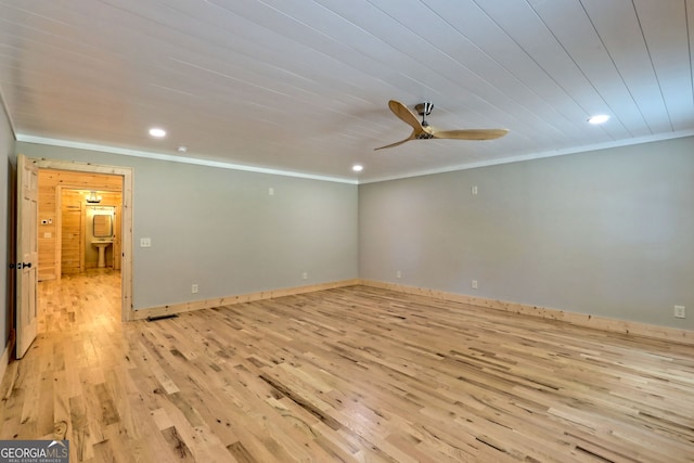 empty room with ceiling fan, ornamental molding, and light wood-type flooring