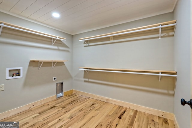 laundry room featuring hookup for a washing machine, wood-type flooring, electric dryer hookup, and wooden ceiling