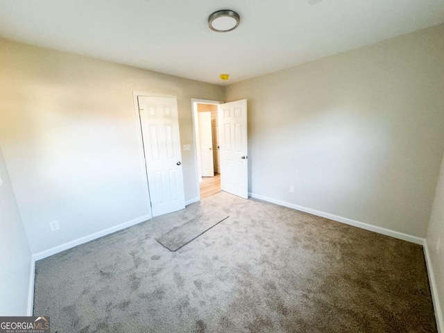 unfurnished bedroom with light carpet