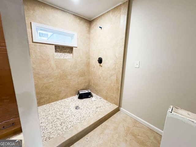 bathroom with tiled shower