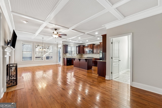 unfurnished living room with beamed ceiling, coffered ceiling, ceiling fan with notable chandelier, and light hardwood / wood-style flooring