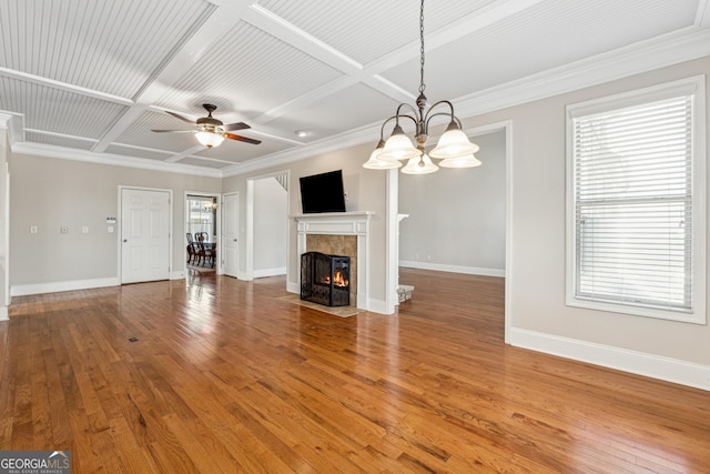 unfurnished living room with coffered ceiling, hardwood / wood-style flooring, a tile fireplace, and ceiling fan