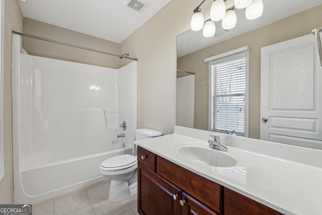 full bathroom with tile patterned flooring, shower / bath combination, vanity, and toilet