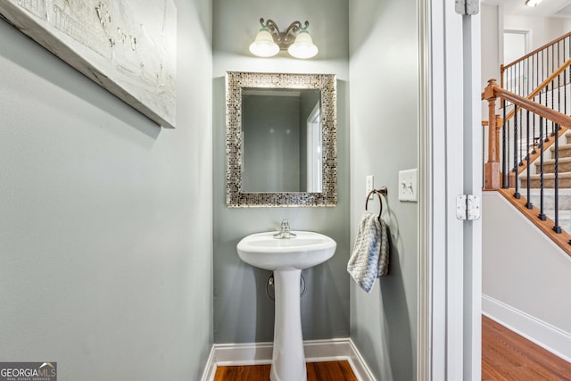 bathroom with hardwood / wood-style floors