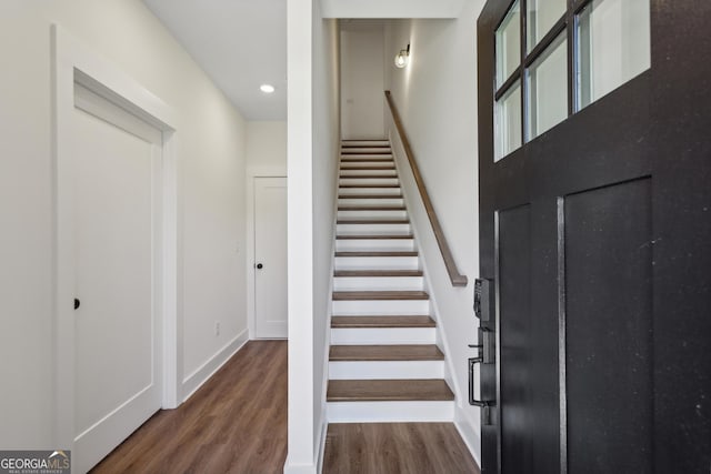 stairs with wood-type flooring