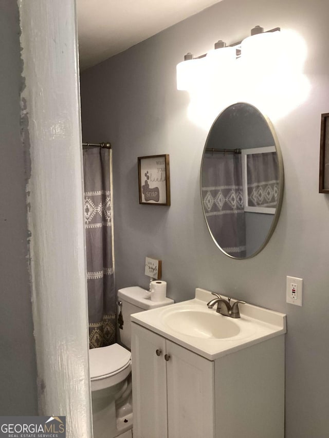 bathroom with vanity and toilet