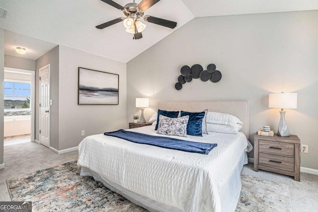 carpeted bedroom featuring ceiling fan and vaulted ceiling