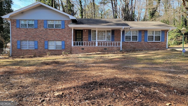 tri-level home featuring covered porch