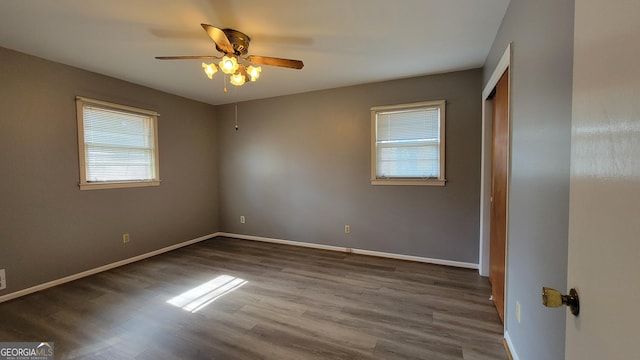 spare room with ceiling fan and hardwood / wood-style floors