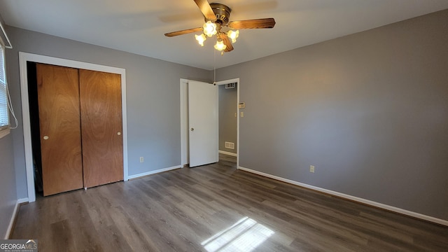 unfurnished bedroom featuring hardwood / wood-style flooring and ceiling fan