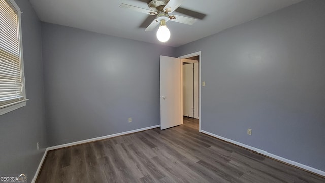 unfurnished room with hardwood / wood-style floors and ceiling fan