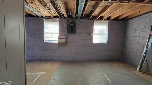 basement with plenty of natural light and electric panel