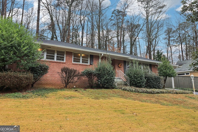 ranch-style house with a front lawn