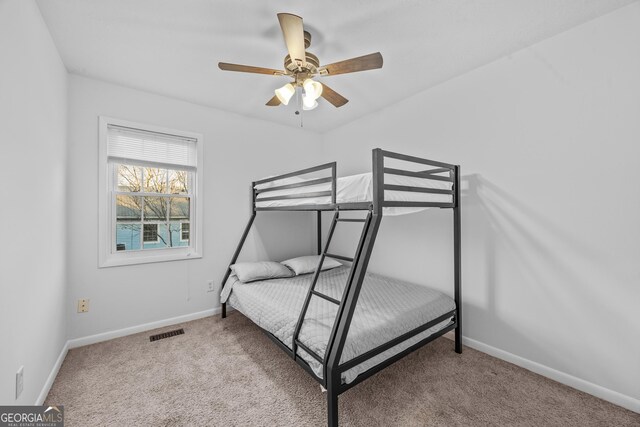 bedroom with light carpet and ceiling fan