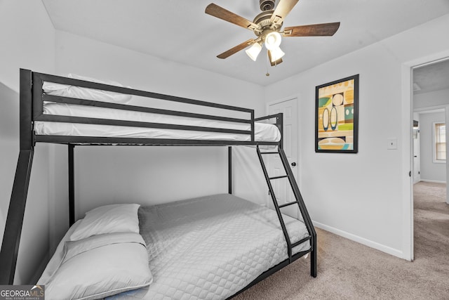 bedroom with light carpet and ceiling fan