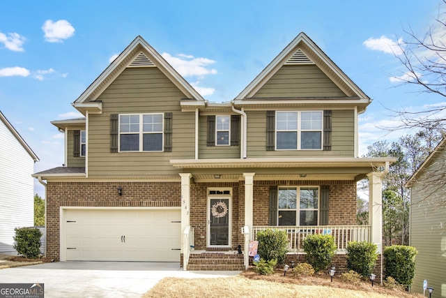 view of front of property with a garage and covered porch