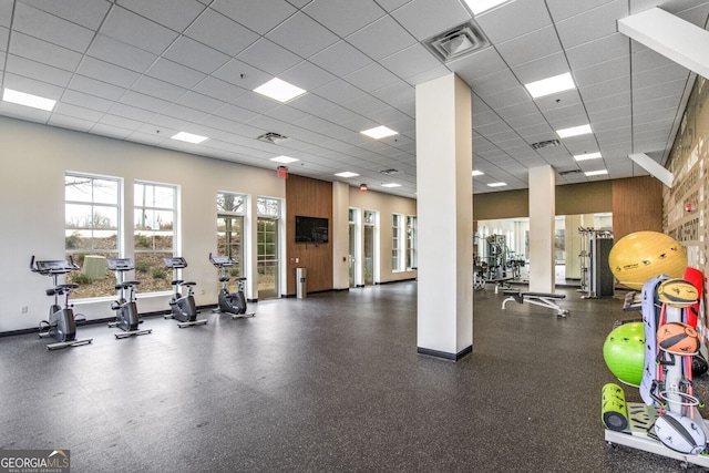 exercise room featuring a drop ceiling