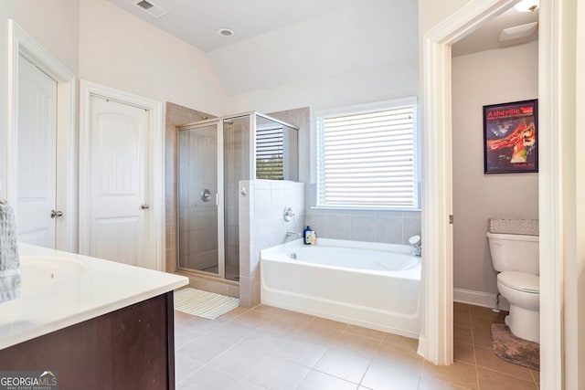 full bathroom featuring toilet, independent shower and bath, tile patterned flooring, and vanity