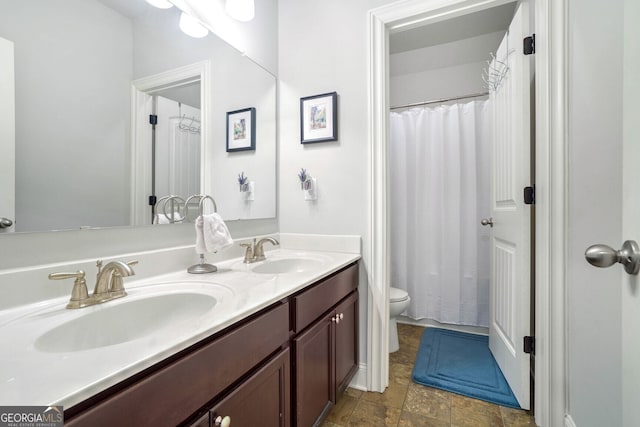 bathroom with vanity, toilet, and a shower with shower curtain