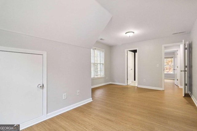 spare room with light wood-type flooring