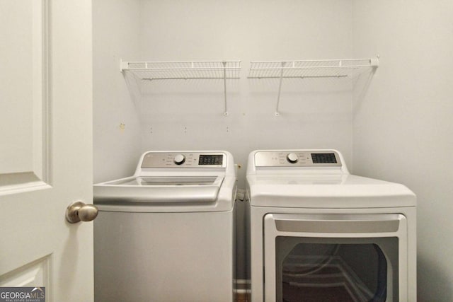 washroom featuring independent washer and dryer