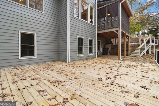 wooden terrace featuring a sunroom