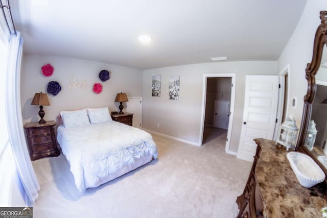 carpeted bedroom featuring a spacious closet