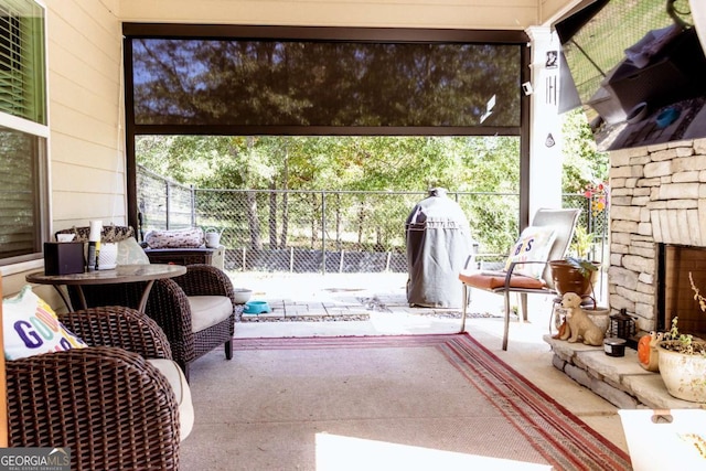 view of patio / terrace with an outdoor stone fireplace