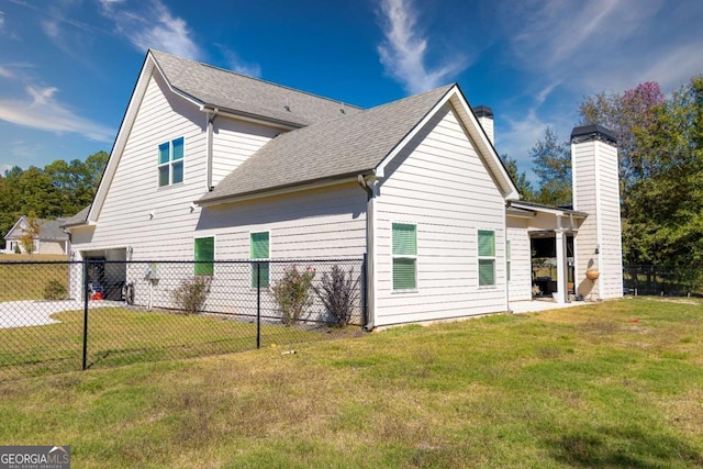 view of side of home featuring a yard