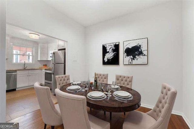 dining area featuring hardwood / wood-style flooring