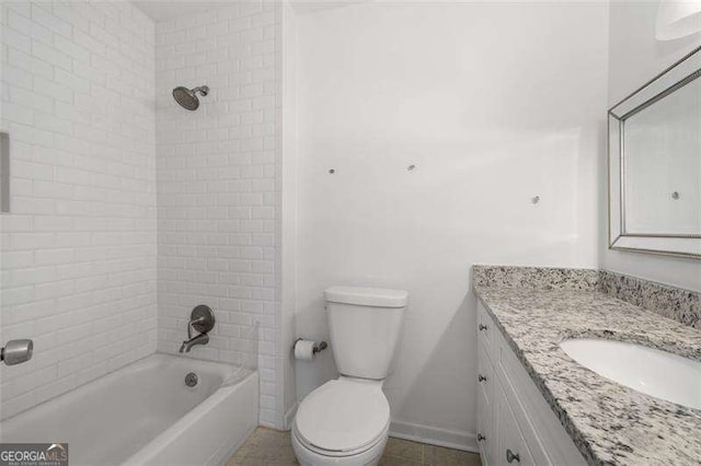 full bathroom featuring vanity, tiled shower / bath combo, and toilet