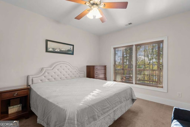 carpeted bedroom with ceiling fan