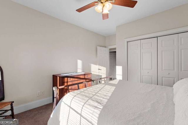 bedroom with carpet floors, ceiling fan, and a closet