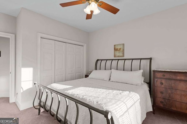 carpeted bedroom with a closet and ceiling fan