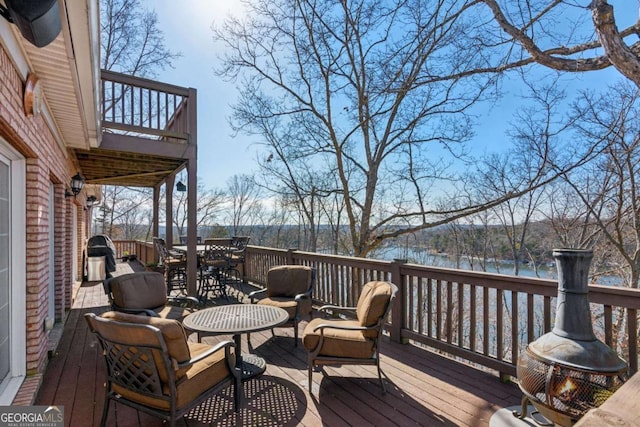 wooden deck with a water view