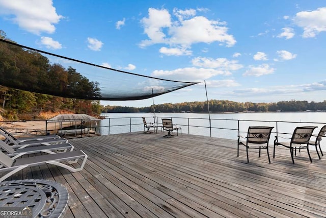 wooden deck with a water view